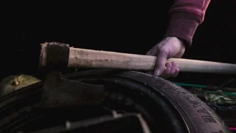 Man takes axe from trunk Stock Footage 147048823