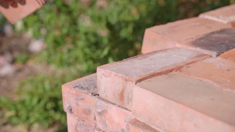 Man takes brick for construction from brick warehouse stack Stock Footage 258873757