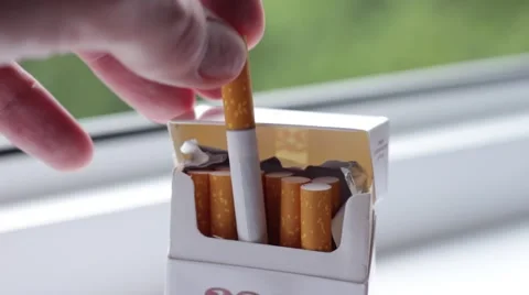 Man takes a cigarette from a pack Stock Footage 65372557