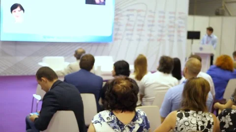 Man takes the conference to the camera. Business men record video at the Stock Footage