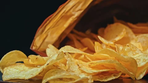 Man Takes Crispy Potato Chips with His Hands Stock Footage 260468655