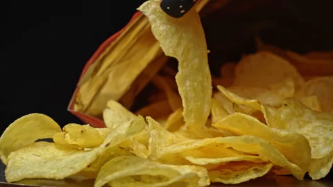 Man Takes Crispy Potato Chips with His Hands Stock Footage 260938258