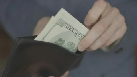 A man takes dollars out of his wallet. close-up Stock Footage 133122935
