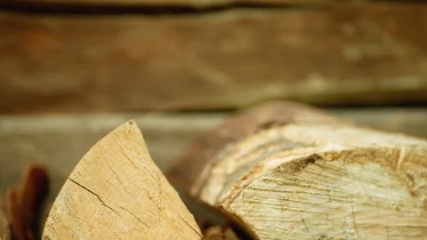 Man takes firewood from a stack Stock Footage 165864014
