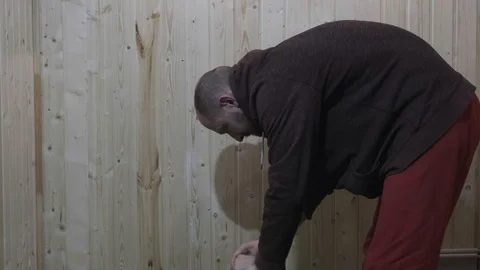 The man takes a folding table and chair and leaves Stock Footage 119547266