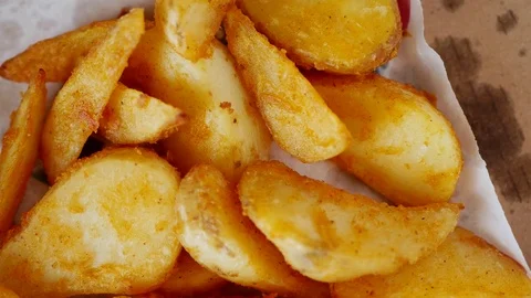 Man takes fried potatoes. Stock Footage 70402665