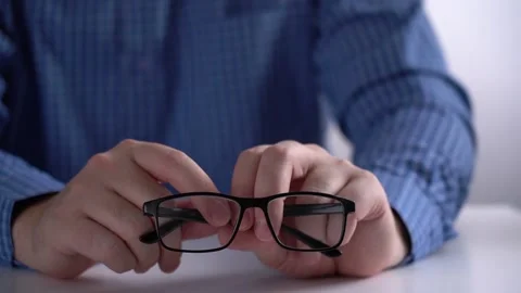 Man Takes Glasses from Work Table. Office work Stock Footage 166514393
