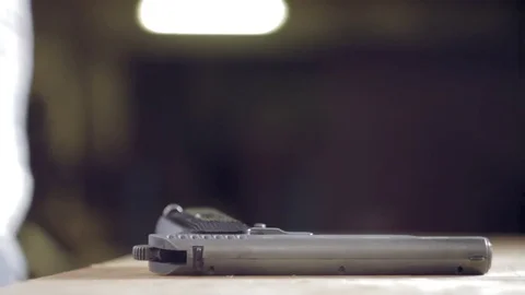 Man takes a gun close-up Stock Footage 71543752
