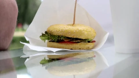 Man Takes a Hamburger Stock Footage 65156264