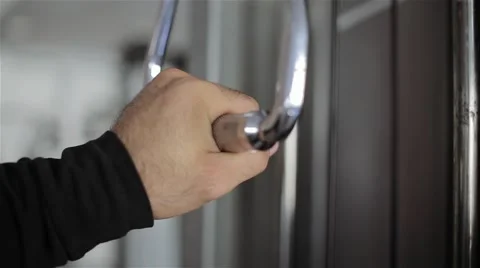 A man takes his hand simulator in the gym Stock Footage 56636581