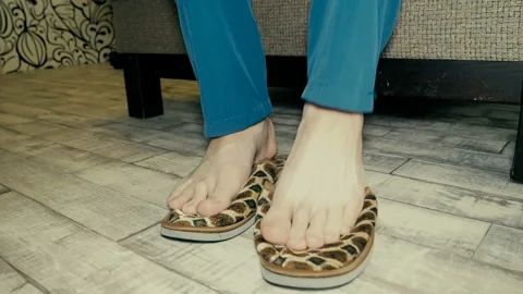 The man takes off his Slippers. Stock Footage 101412265