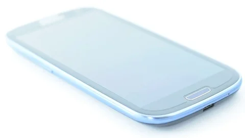 Man takes his smartphone from a table. Stock Footage 74290686