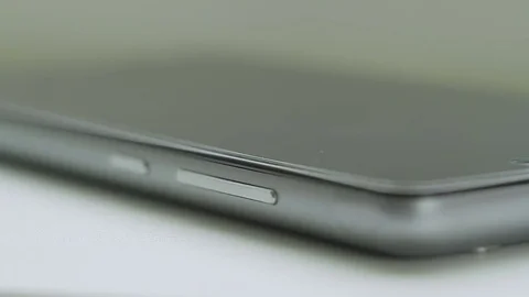Man takes his smartphone from a table Stock Footage 85154794