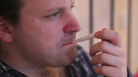 Man takes his temperature in bed Stock Footage 21253241