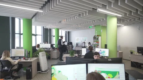 Man takes jacket and walks across architect agency office Stock Footage 325996421