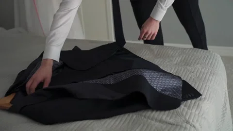 A man takes a jacket to put it on Stock-Footage 329092287