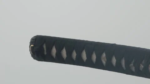 Man takes katana covered with samegawa out of special case Stock Footage 131939845