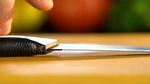 A man takes a knife Stock Footage 85226157