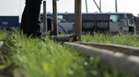 Man takes a log and puts drill Stock Footage 59370537