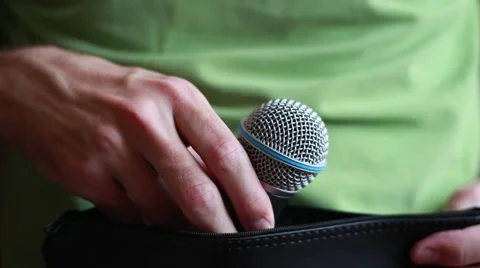 Man takes microphone from the case 動画素材 64621384