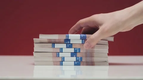 The man takes money from the table Stock-Footage 185945060