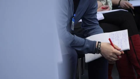 A man takes notes about a work meeting in the office. Stock Footage 257078195