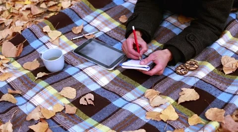Man takes notes in a diary Stock Footage 56639737