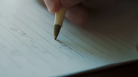 A man takes notes in a diary Stock Footage 122934395