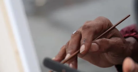 A man takes notes, sketches, or makes a plan on a blank white sheet of paper. Stock Footage 268760420