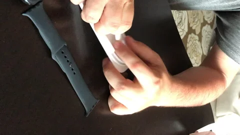 A man takes out a cord from the box with a charge. Makes unpacking smart wa.. Stock Footage 279738307