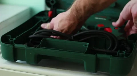 Man takes perforator from a case Stock Footage 65371141