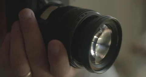 Man takes picture with digital camera at home Stock Footage 78037796