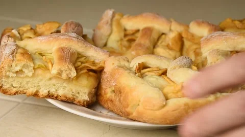 The man takes a piece of apple pie. Stock Footage 145085764