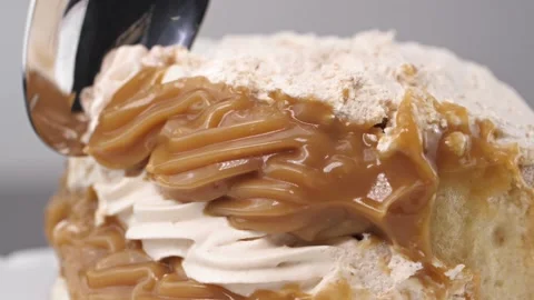 A man takes a piece of cake with a spoon, macro Photography. Close up Stock Footage 144334450