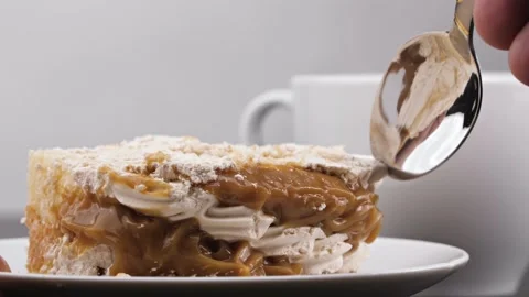 A man takes a piece of cake with a spoon, macro Photography. Close up Stock Footage 144334451