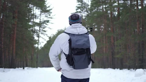 Man takes a selfie, leads a stream to a smartphone Stock Footage 230096761