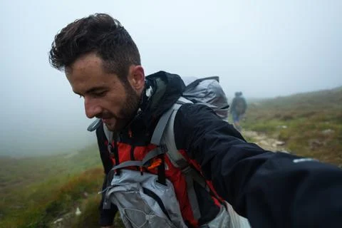 A man takes a selfie while walking. Ukrainian Carpathians Stock Photos