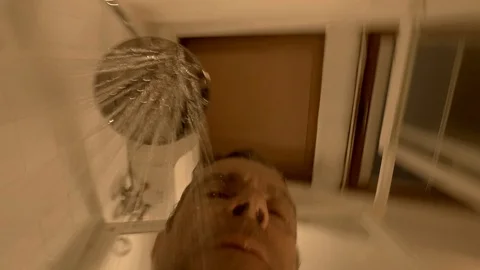 A man takes a shower, a close-up view under the water Stock Footage 103165814
