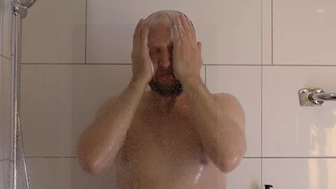 The man takes a shower. Stock Footage 243372446