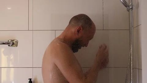 The man takes a shower. Stock Footage 243372531