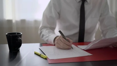 Man takes a sip of coffee at work Stock Footage 71628860
