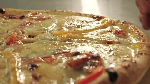 Man takes a slice of hot pizza with his hand Video stock 130850045