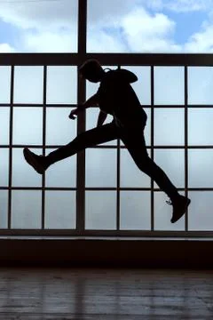 Man takes a step in the jump. Stock Photos