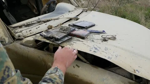 Man takes things from a drowned jeep car Stock Footage 146649717
