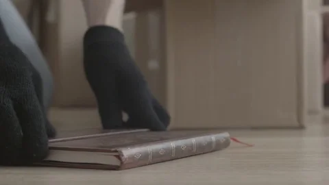 Man takes things out of the box. Flips the box and pours the contents Stock Footage
