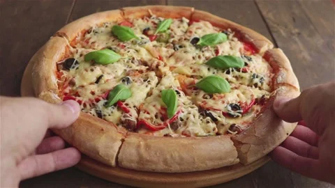Man takes two slices of pizza close up Stock Footage 124269042