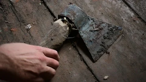 Man takes a very rusty old ax Video stock 135412698