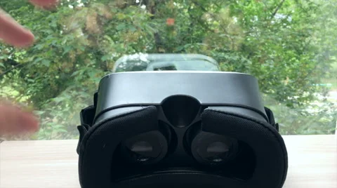 Man takes virtual reality goggles 4K Stock Footage 67551832
