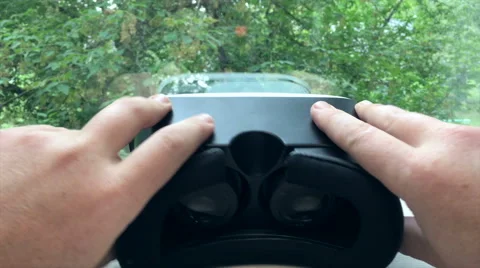 Man takes virtual reality goggles 4K Stock Footage 67581323