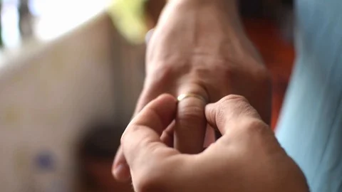 A man takes off a wedding ring. Stock Footage 127761123